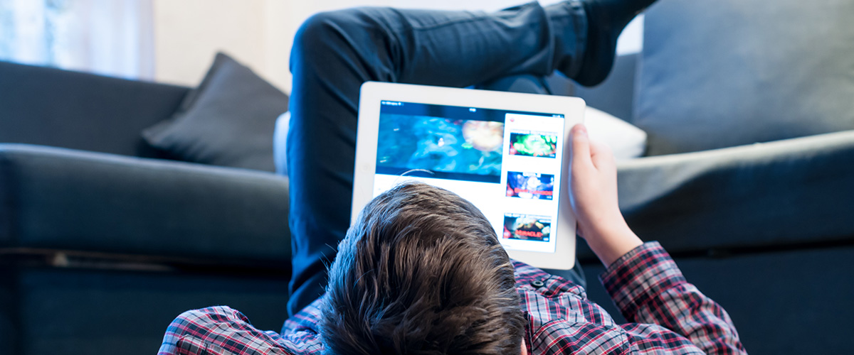 Photograph of young people using tablets